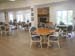 Dining area with large windows and fireplace